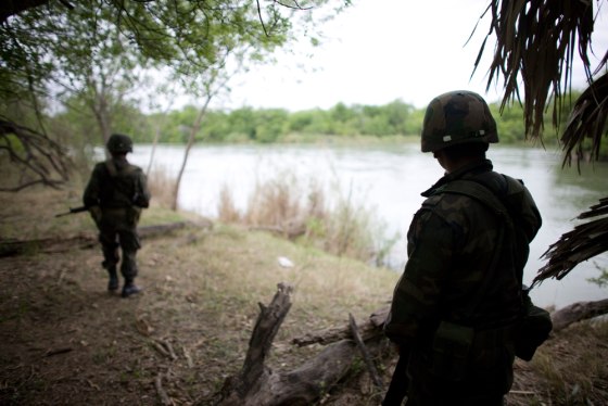 Image: Mexican soldiers patrol along the bank of the Bravo river near Los Guerra, on Mexico's northeastern border with the U.S.